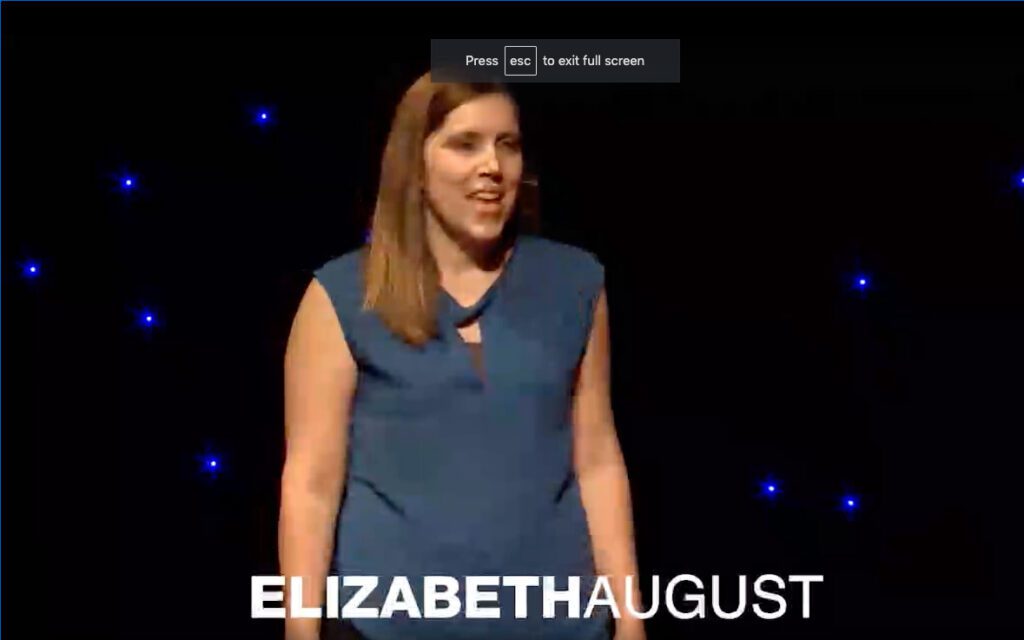 A screenshot of the women Elizabeth speaking on the stage